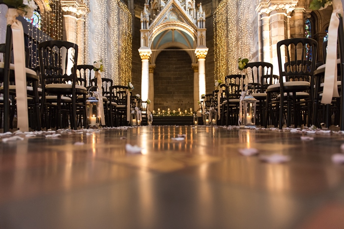 wedding ceremony under soaring ceilings of Mansfield Traquair dressed beautifully with fairy lights - image by Julie Tinton Photography 