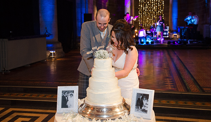 Bride and groom cutting their wedding cake at Masfield Traquair in Edinburgh