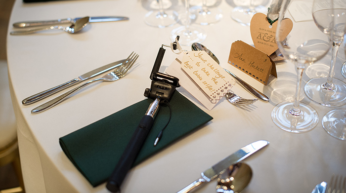 table set up and selfie sticks for wedding guests