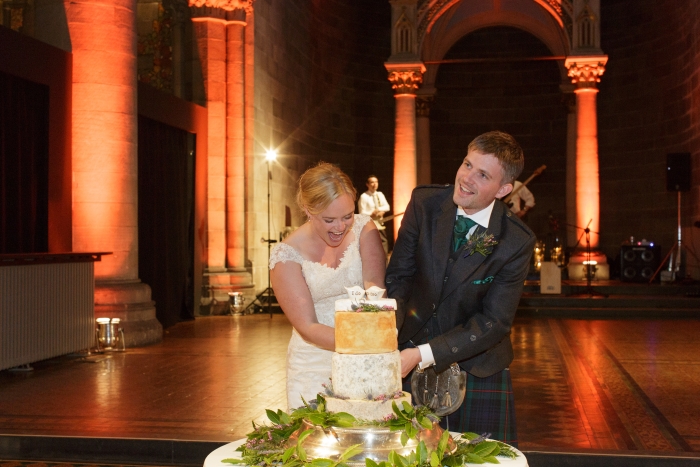 cutting wedding cake -photo credit Blue Sky Photography 