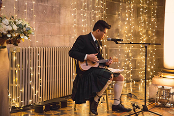 Bride's brother performign during the ceremony at Mansfield Traquair in Edinburgh. Photo credit: Kirsty Stroma Photography