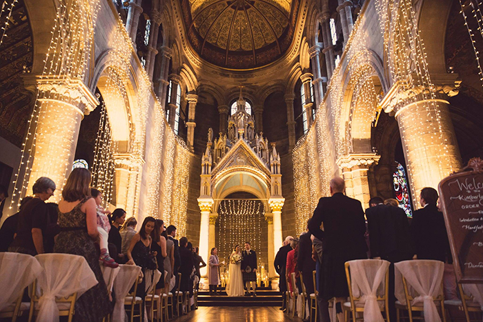 Fairy lights created an incredibly romantic background for Kim & Dominic's wedding ceremony at Mansfield Traquair in Edinburgh. Photo credit: Kirsty Stroma Photography