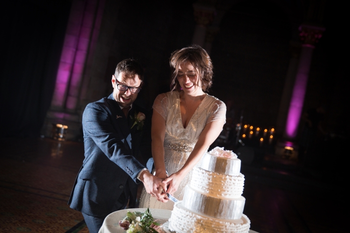Beautiful picture of Lesley and Dave cutting their gorgeous wedding cake at Mansfield Traquair - unique wedding venue in  Edinburgh | Photo credit Stuart Craig Photography