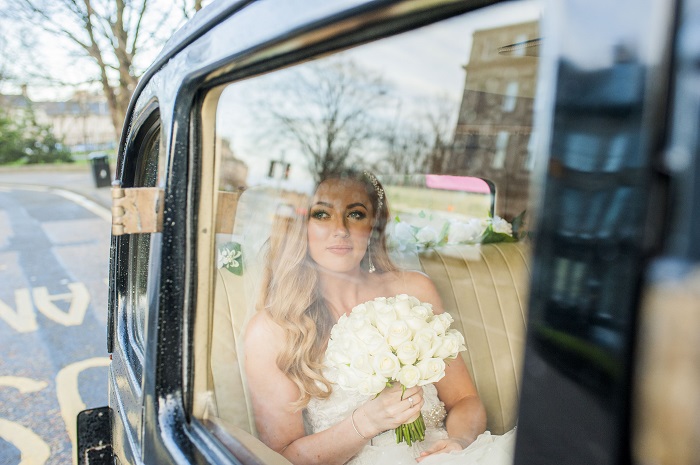 A beautiful bride on her way to her Edinburgh Mansfield Tranquair Wedding 