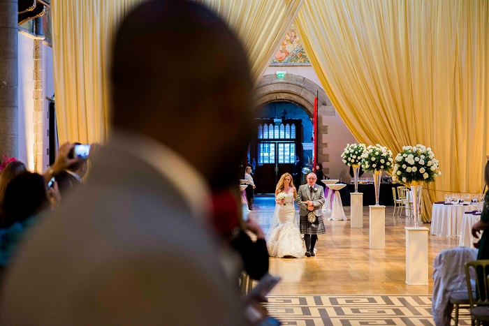 A bride and her father walking down the aisle at Mansfield Tranquair, Edinburgh