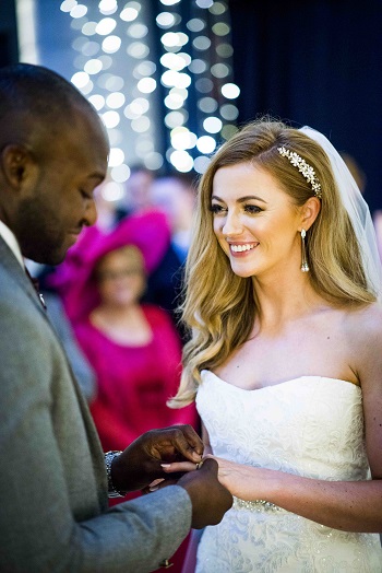 A happy bride and groom exchanging rings and vows at Mansfield Tranquair, Edinburgh