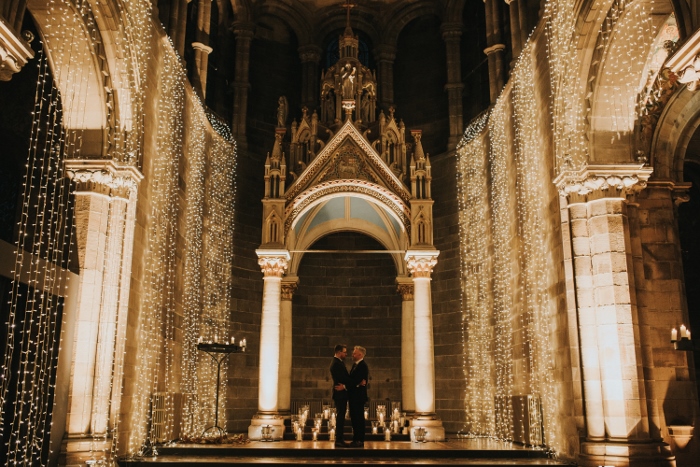 The happy wedded couple with a backdrop of beautiful fairy lights, Mansfield Tranquair, Edinburgh