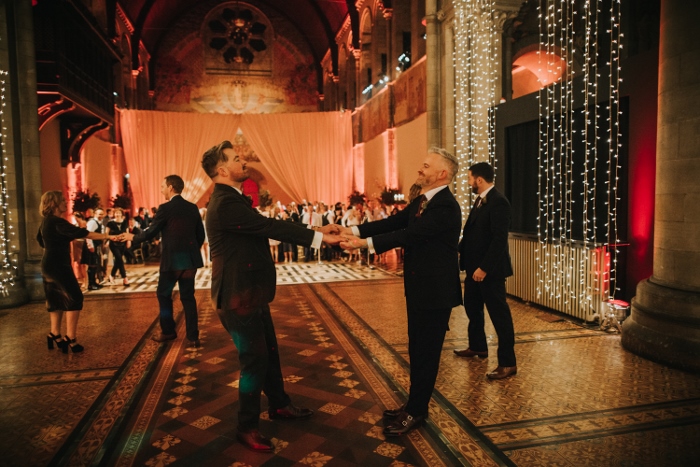 A newly wedded couple happily dancing in the stunning Mansfield Tranquair, Edinburgh